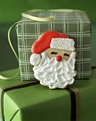 Father Christmas biscuit on gift boxes 