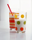 Two Colorful Glasses of Milk with Straw