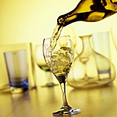 Pouring White Wine into a Glass