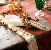 Autumnal place setting with fabric napkin and fork