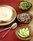 Tortillas with Sliced Avocado, Refried Beans and Salad