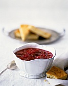 Cranberry Relish in a White Bowl with Pecans and Cornbread