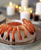 Ice-cooled shrimps with cocktail sauce by candlelight