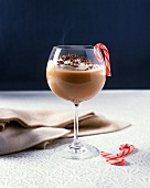 Hot Chocolate and Baileys Irish Cream Served in a Stem Glass with a Candy Cane