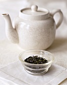 Dried tea leaves and teapot