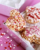 Caramelised puffed rice hearts with glacé icing