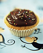 Cup cake with chocolate icing & 100s & 1000s for children