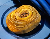 Coiled bun with pecan nuts