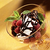 Parfait with brownies, raspberries and cream