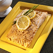 Poached salmon fillet with lemons and pepper