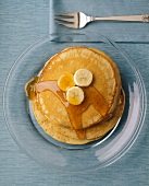 Pancakes with Banana Slices and Syrup