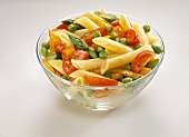 Penne with Tomatoes, Peas and Bell Peppers in a Glass Bowl