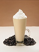A Latte Smoothie with Whipped Cream and Coffee Beans