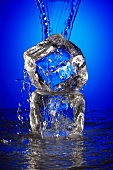 Water Pouring over an Ice Cube