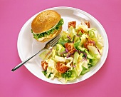 A Grilled Chicken Sandwich with Lettuce and Provolone and a Tossed Salad