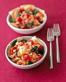 Ravioli with white beans, spinach and tomatoes