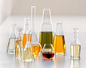 Nine Glass Jars of Assorted Oils