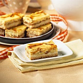 Caramel slices on a white plate and on a serving tray