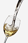 White Wine Pouring into a Glass