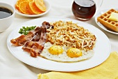 Fried Eggs with Bacon and Shredded Homefried Potatoes; Waffle and Syrup