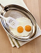 Eggs, Sunny Side Up, Frying in a Skillet with Spatula