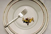 Vitamins at a Place Setting with a Fork