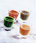 Four shots of vegetable juice