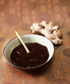 Hoisin Sauce in a Bowl with Fresh Ginger Root