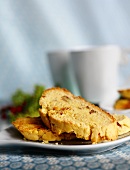 Biscotti on a Plate with Coffee Cups in Background