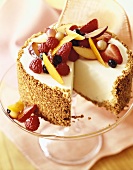 Cheesecake with Crumb Crust and Fresh Fruit Topping; Slice Removed