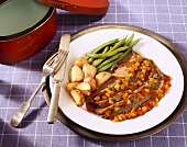 Shaker Flank Steak with Vegetable Sauce, Roasted Potatoes and String  Beans on Plate with Utensils