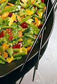 Sesame Vegetable Stir Fry on Black Plate with Black Chopsticks