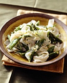 Noodles with green asparagus and peas in cream sauce