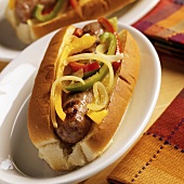 Sausage, peppers and onions in a hot dog roll