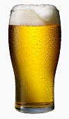 A Glass of Frothy Beer in a Cold Glass