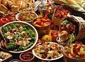 Buffet Spread of Salad, Pasta Salad, Fruit, Corn on the Cob, and Bread