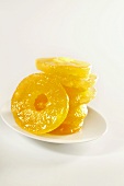 Plate with Stack of Candied Pineapple Rings on White