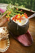 Drink in hollowed-out coconut