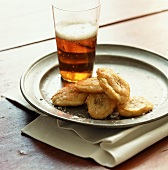 Banana chips and glass of beer