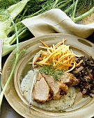 Sliced Pork with Wild Rice and Julienne Vegetables on a Plate