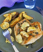 Chicken breast with artichokes and potato wedges
