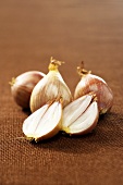 One Shallot Cut in Half with Three Whole Shallots