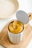 Opened Can of Apple Pie Filling on a Cutting Board, Pie Crust