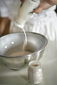 Milk Being Poured into a Bowl