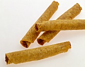 Four Taquitos on a White Background