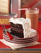A Slice of Chocolate Cake with White Frosting