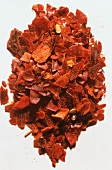 Crushed Dried Chili Peppers on a White Background