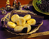 Arepas in a Basket with a Bowl of Black Beans