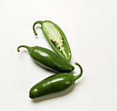 Two Jalapeno Peppers with a Half of One
