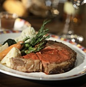 Beef steak garnished with vegetables